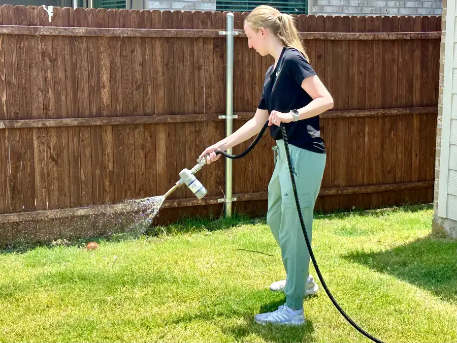 Rhino Scoop team member providing professional yard treatment service